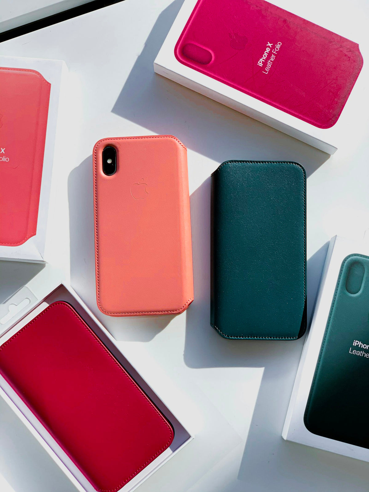 Pink cased phone beside packaging