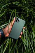 Person holding a black cased phone