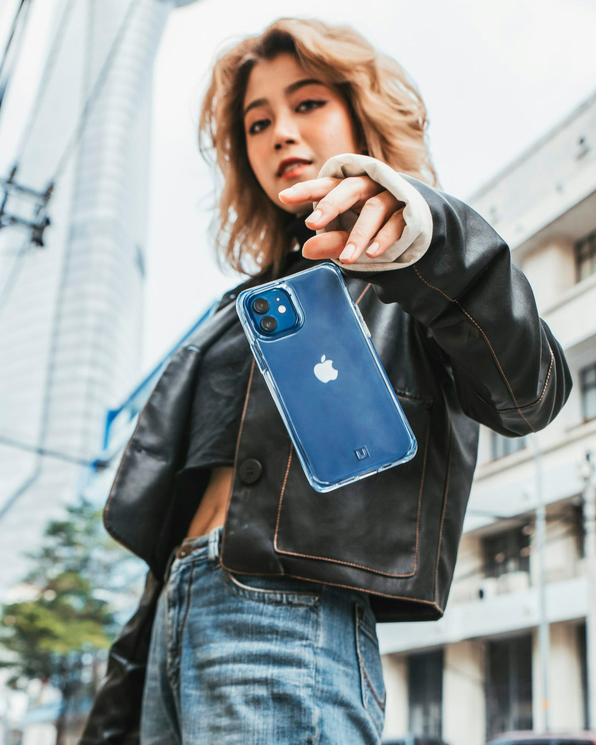 Person holding a blue phone case
