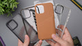 Person holding an orange leather phone case