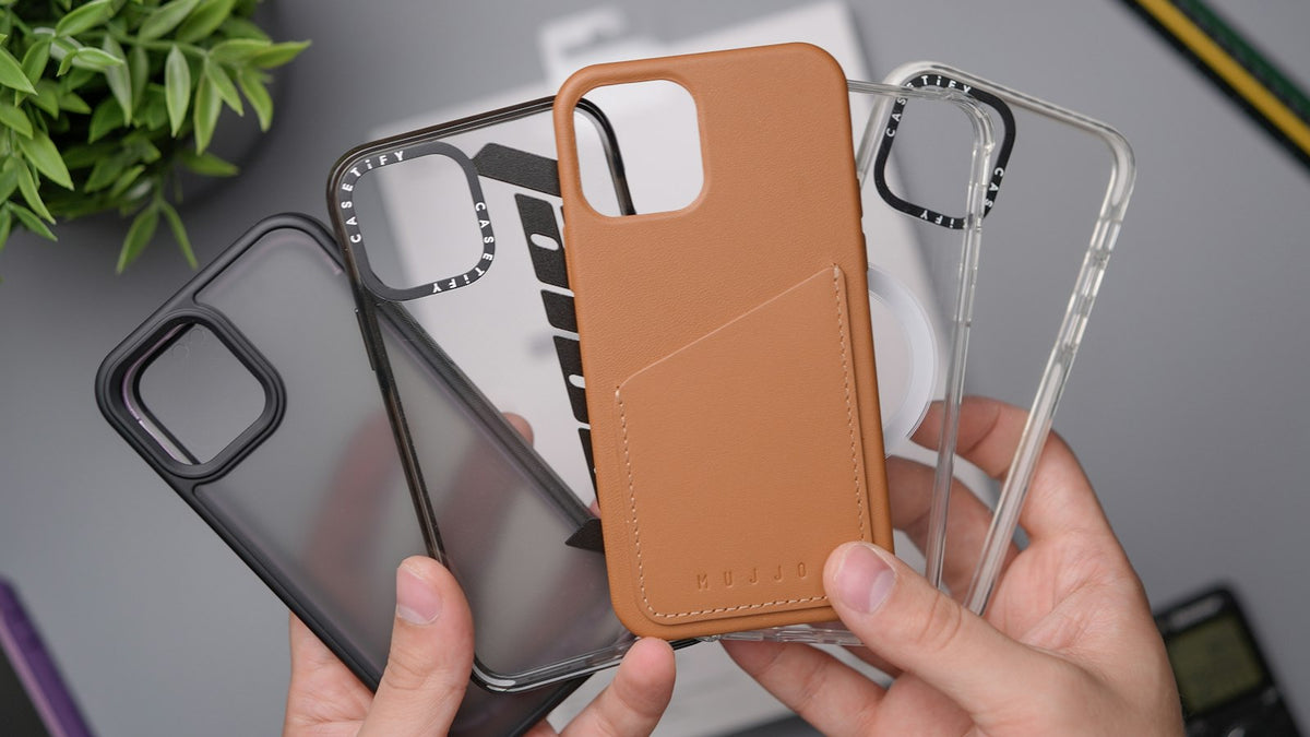 Person holding an orange leather phone case