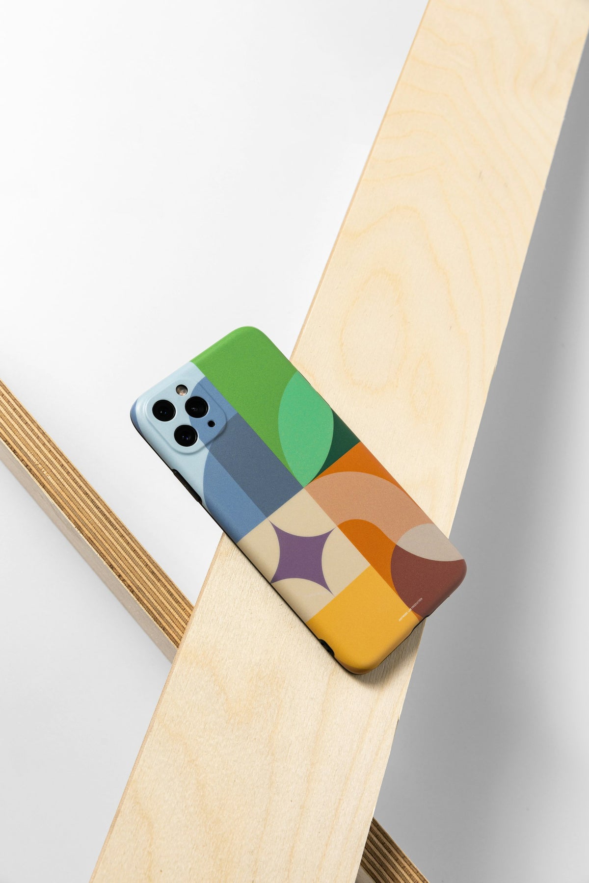 Phone case photographed on a wooden table