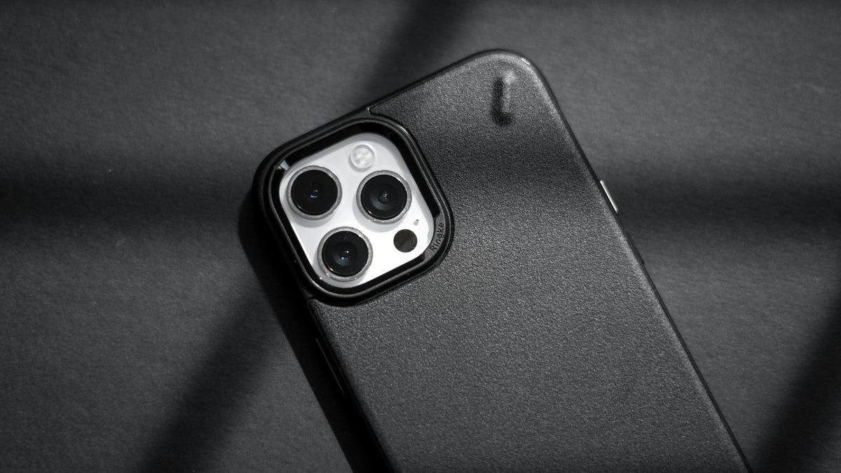 Rugged black case on a dark textile